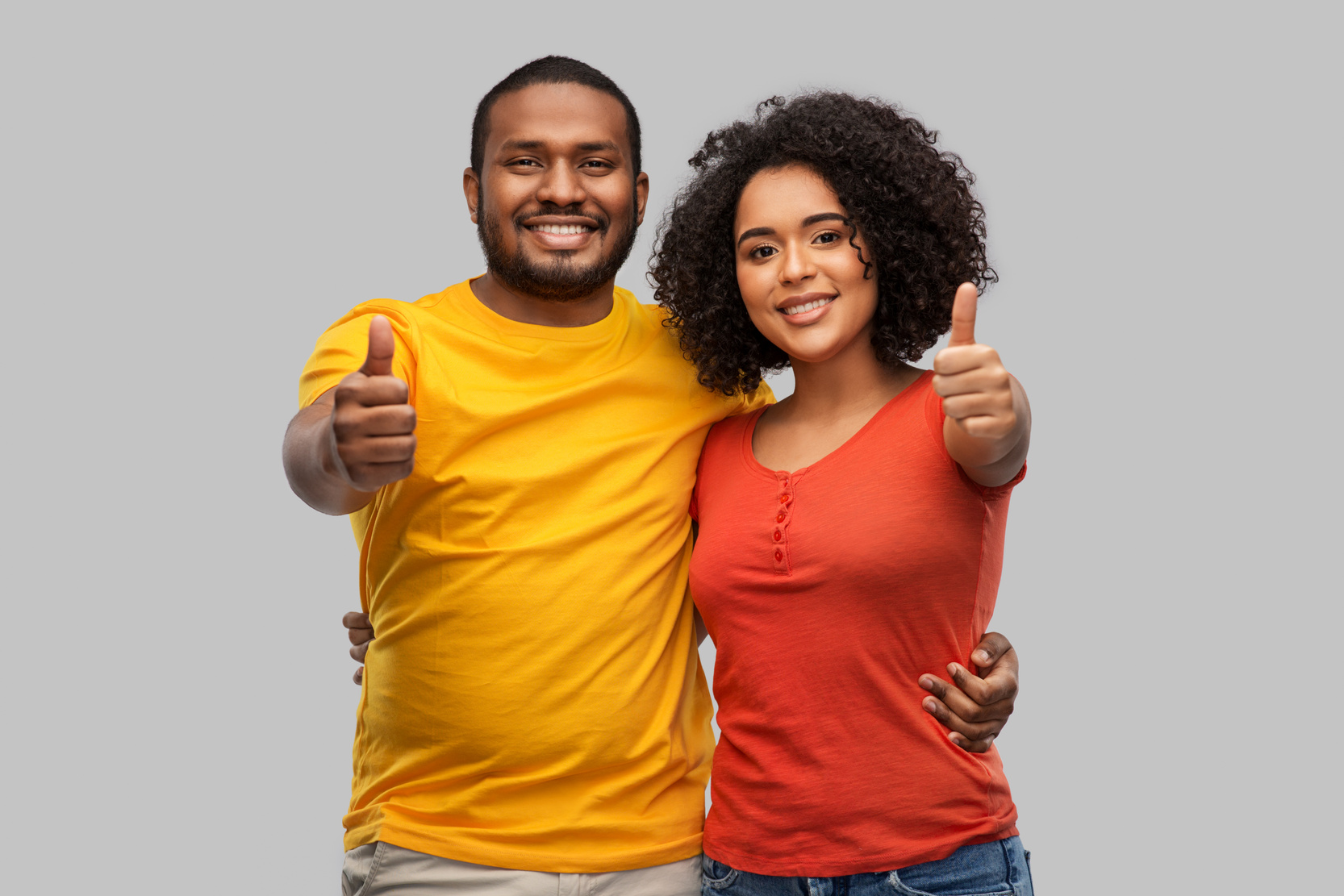Happy African American Couple Showing Thumbs up